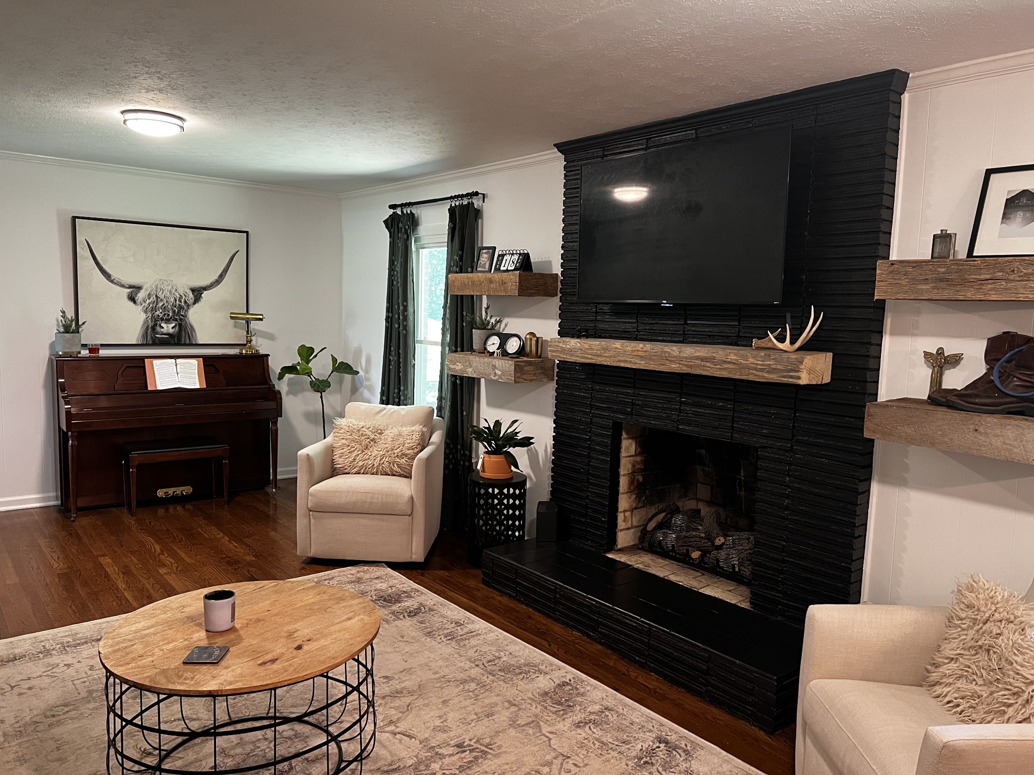 304 South Hummingbird Lane Dickson, TN 37055 - Photo 17 of 37 a living room with furniture a flat screen tv and a fireplace