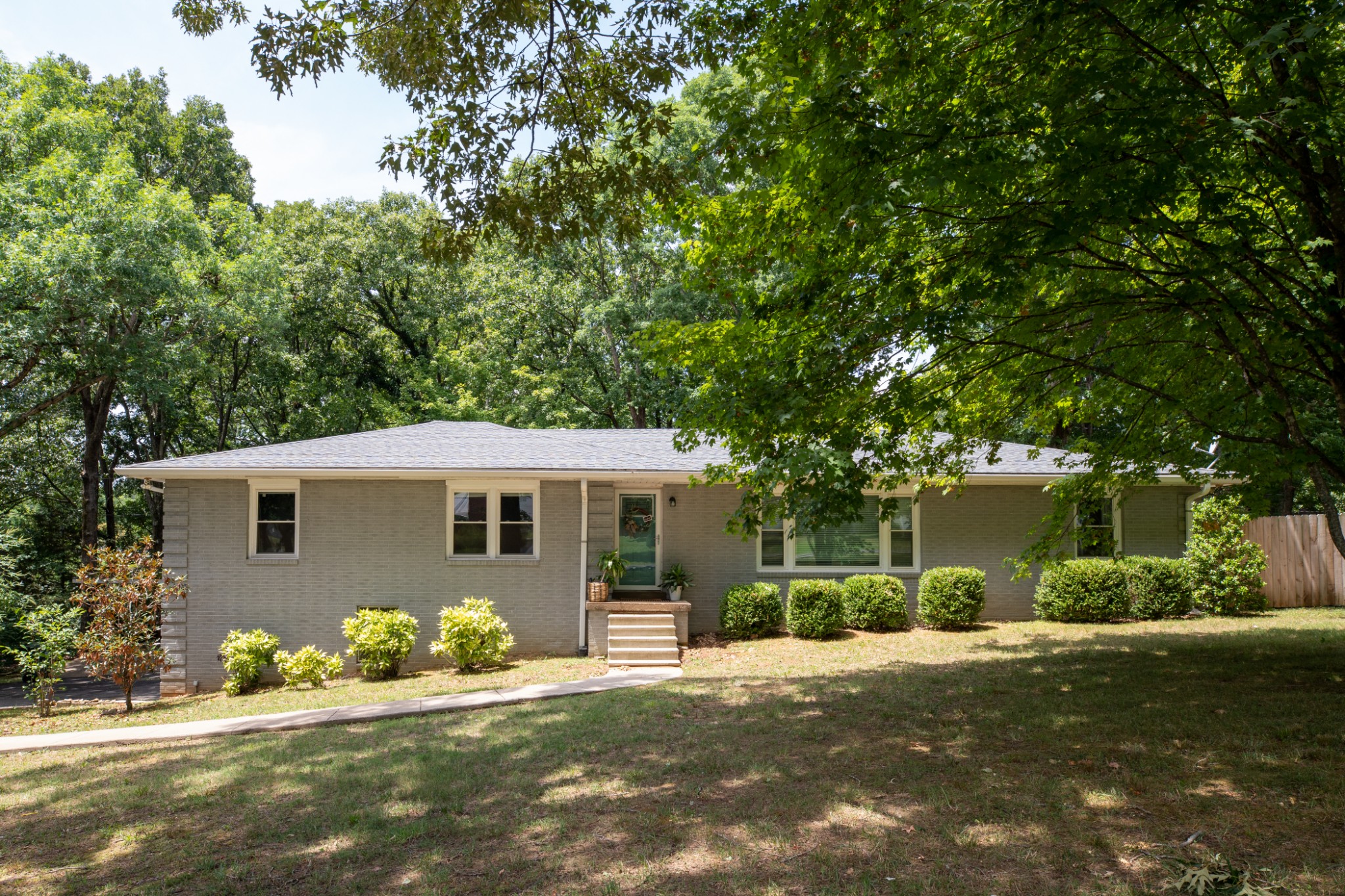 304 South Hummingbird Lane Dickson, TN 37055 - Photo 2 of 37 a front view of a house with a yard and garage