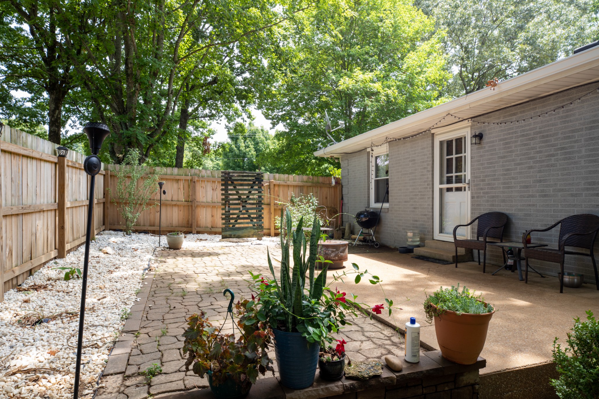 304 South Hummingbird Lane Dickson, TN 37055 - Photo 37 of 37 a view of a chairs and table in backyard