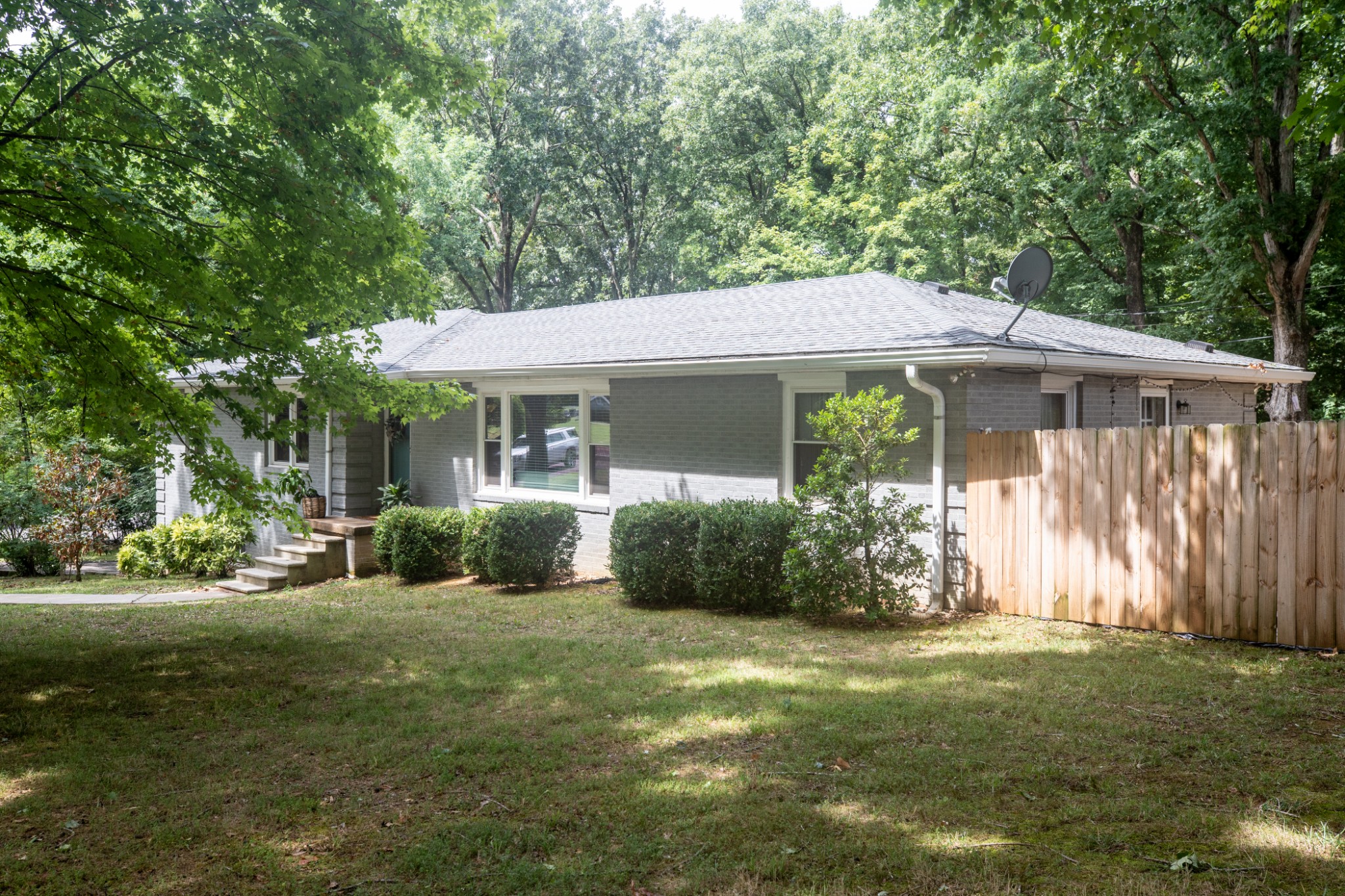 304 South Hummingbird Lane Dickson, TN 37055 - Photo 4 of 37 a view of a house with yard and a garden