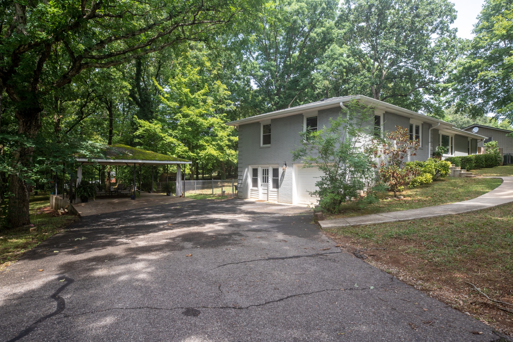 304 South Hummingbird Lane Dickson, TN 37055 - Photo 5 of 37 a front view of house with yard and trees around