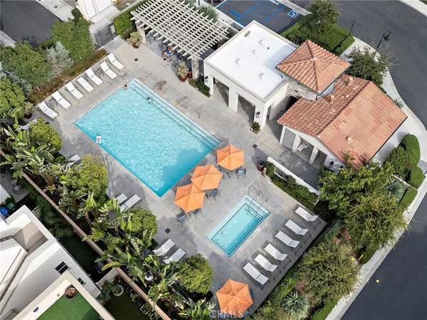 an aerial view of a house with a yard and garden