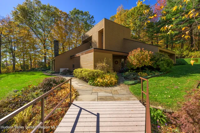 a view of a backyard with sitting area