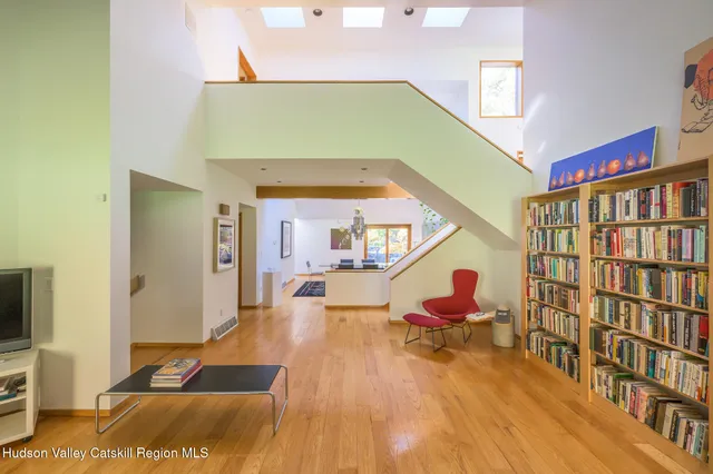 a kitchen with stainless steel appliances granite countertop a refrigerator a sink dishwasher and a stove with wooden cabinets