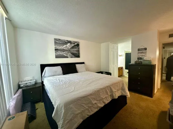 a bed room with a bed and wall painting