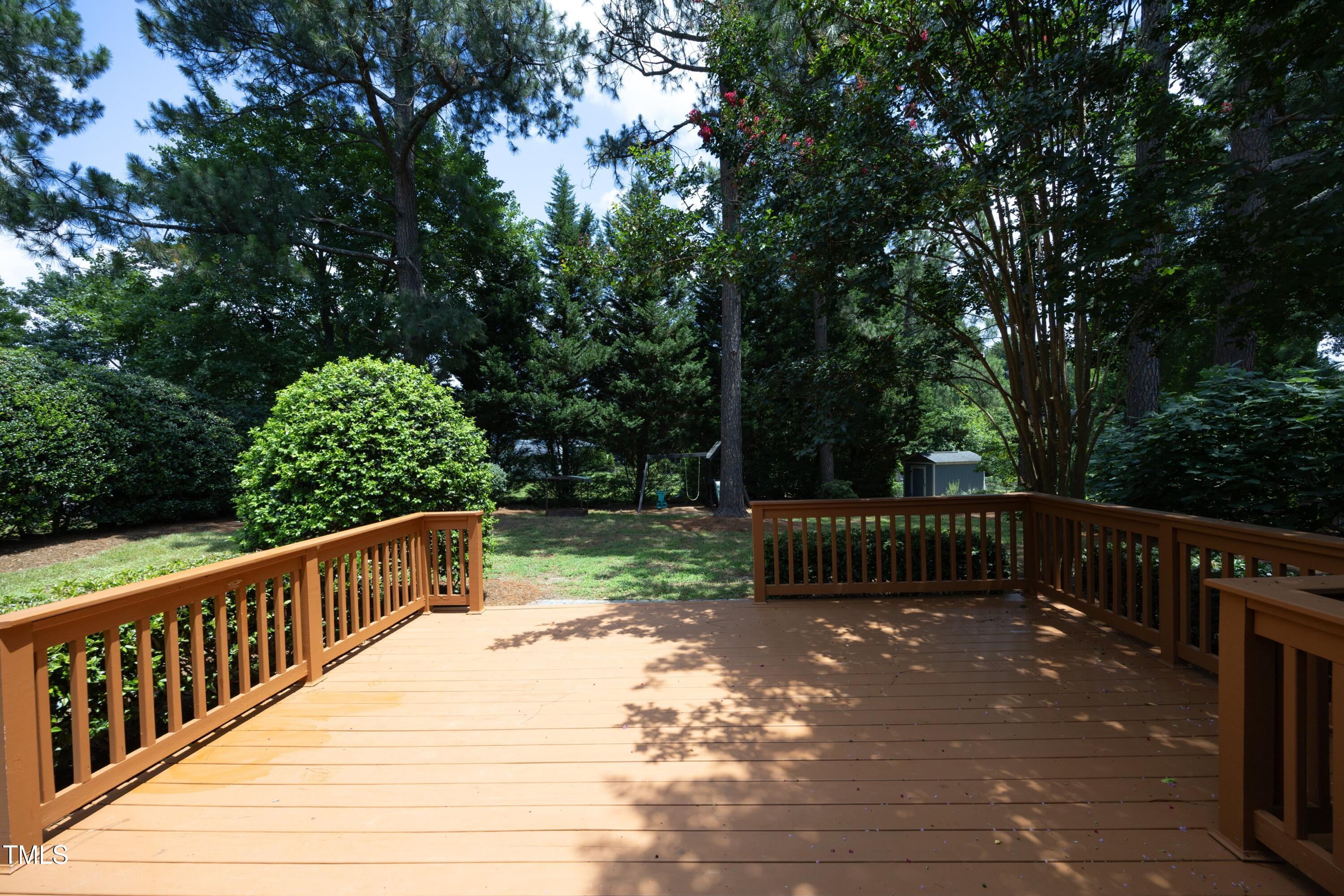 3112 Carovel Court Raleigh, NC 27607 - Photo 34 of 44 New deck looking onto large, fenced back yard.