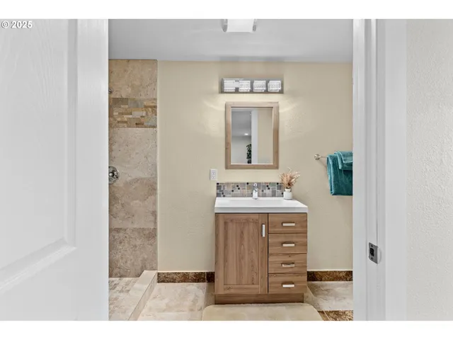 a room with a bed and a potted plant