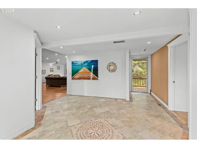 a living room with furniture and kitchen view