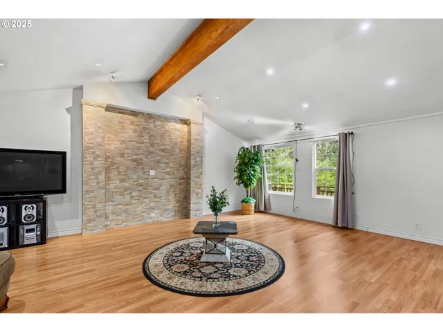 a living room with furniture potted plant and a fireplace