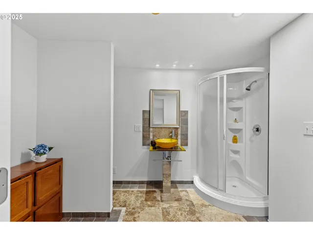 a bedroom with a bed and a table in it