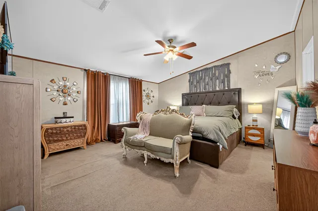 a bedroom with a bed furniture and window