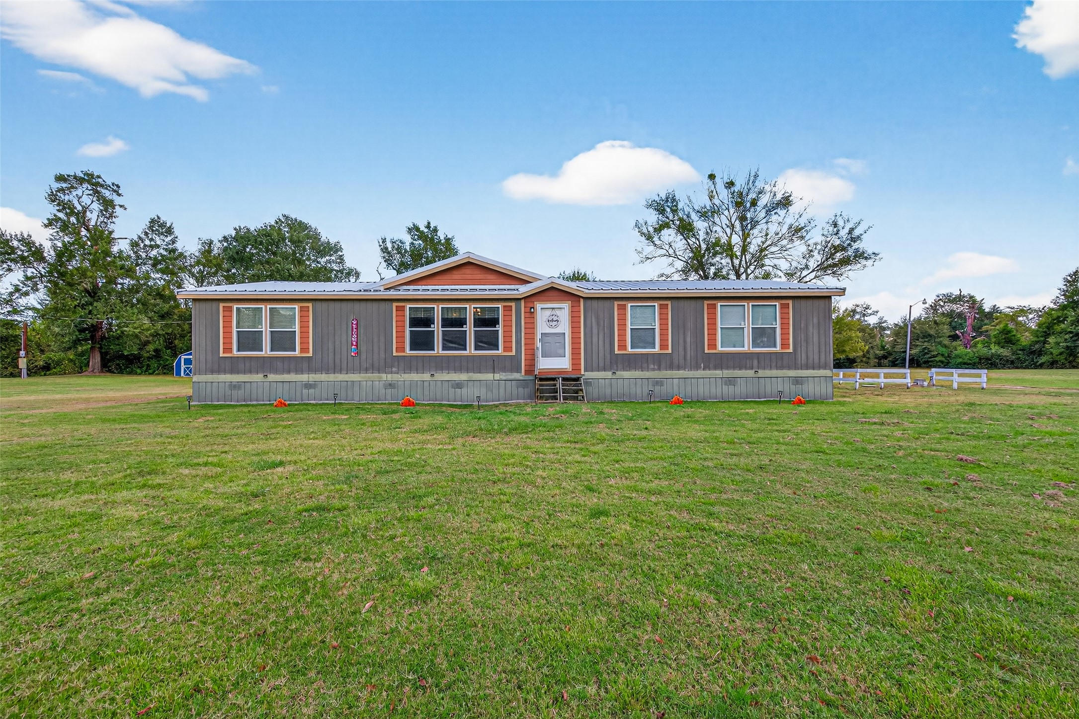 10715 Bozeman Ferry Road Midway, TX 75852 - Photo 2 of 50 a view of a house with a backyard and a garden