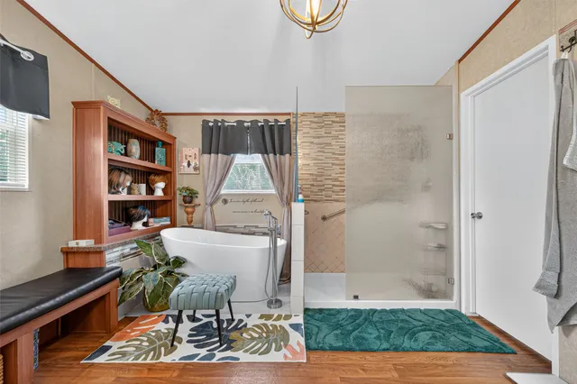 a living room with furniture a rug and a table