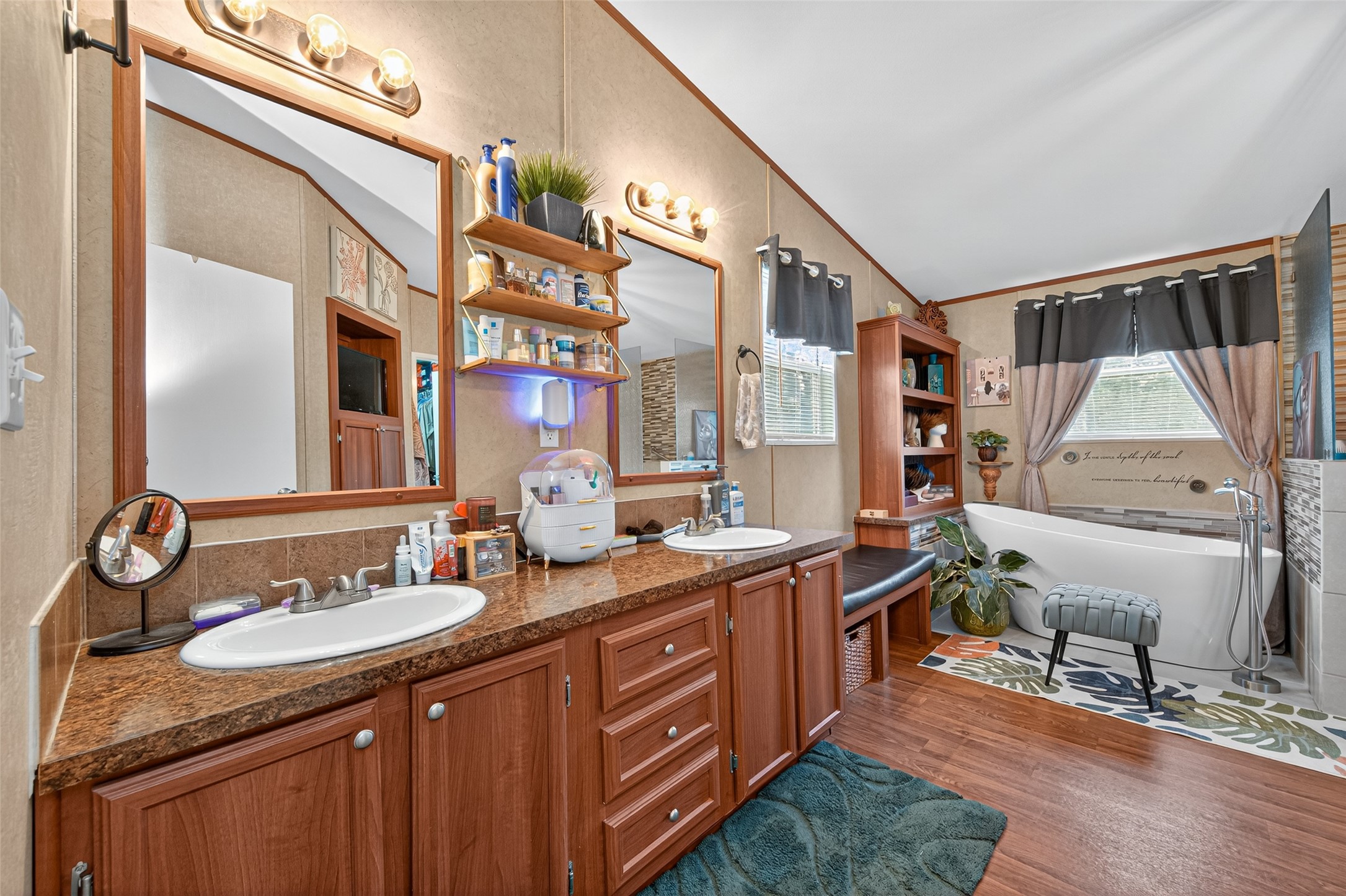10715 Bozeman Ferry Road Midway, TX 75852 - Photo 22 of 50 a bathroom with a double vanity sink and a mirror