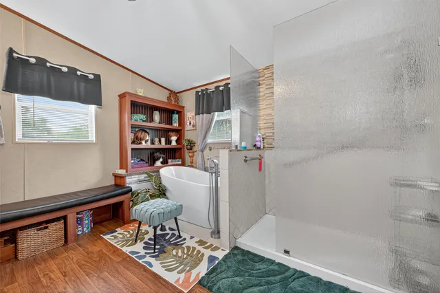 a living room with a couch and a book shelf