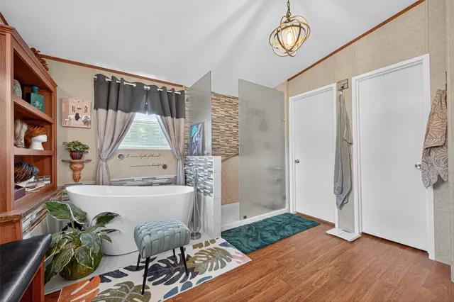 a view of an entryway with wooden floor