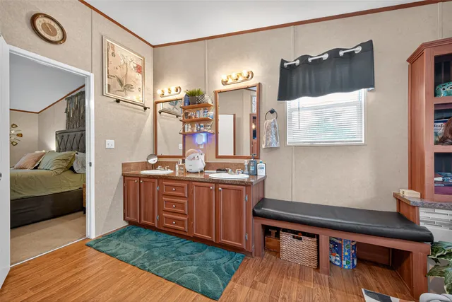 a bathroom with a sink a mirror and a bathtub