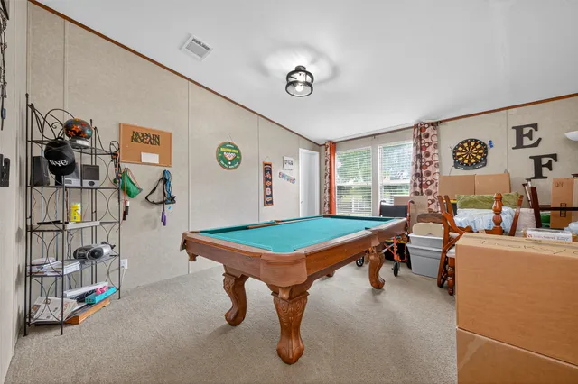 a room with furniture and air hockey table