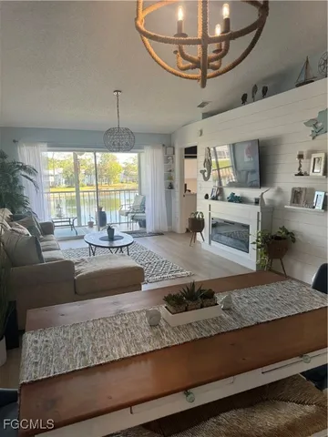 a view of living room with granite countertop furniture and a chandelier