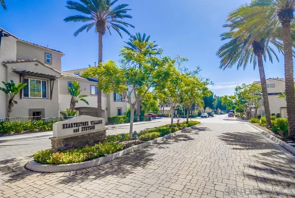 1298 Fools Gold Way, Unit 4 Chula Vista, CA 91913 - Photo 38 of 38 a palm tree sitting in front of a house with a yard