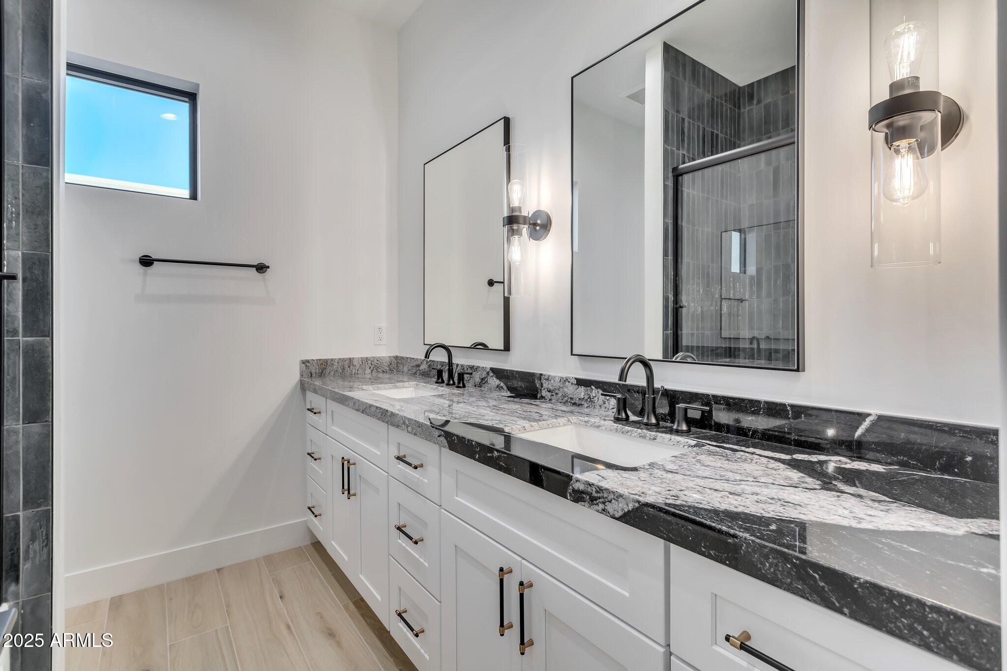 1602 East Cloud Road Phoenix, AZ 85086 - Photo 29 of 45 a bathroom with a granite countertop sink mirror and double