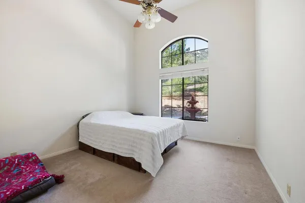 a bedroom with a bed and a table