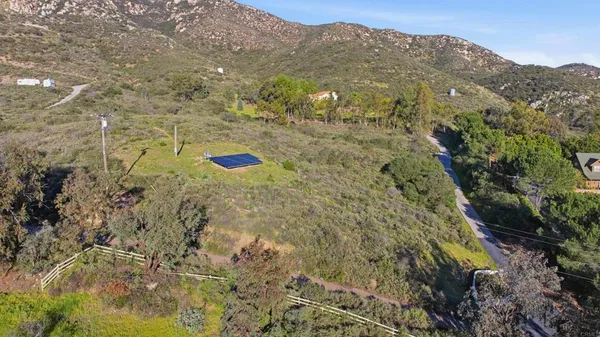 a aerial view of a house with a yard