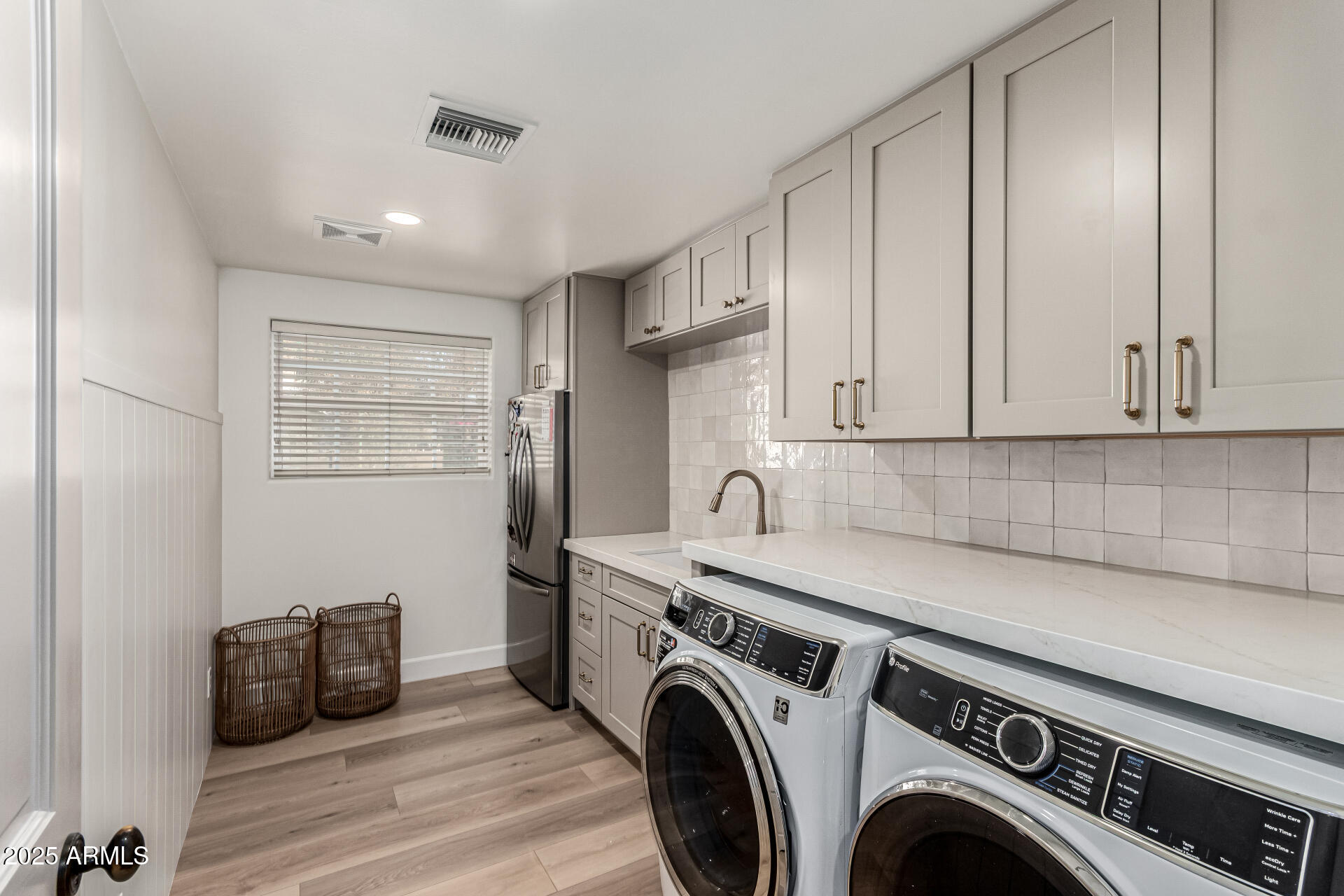 2552 East Ridgewood Lane Gilbert, AZ 85298 - Photo 27 of 80 a view of storage and utility room with washer and dryer