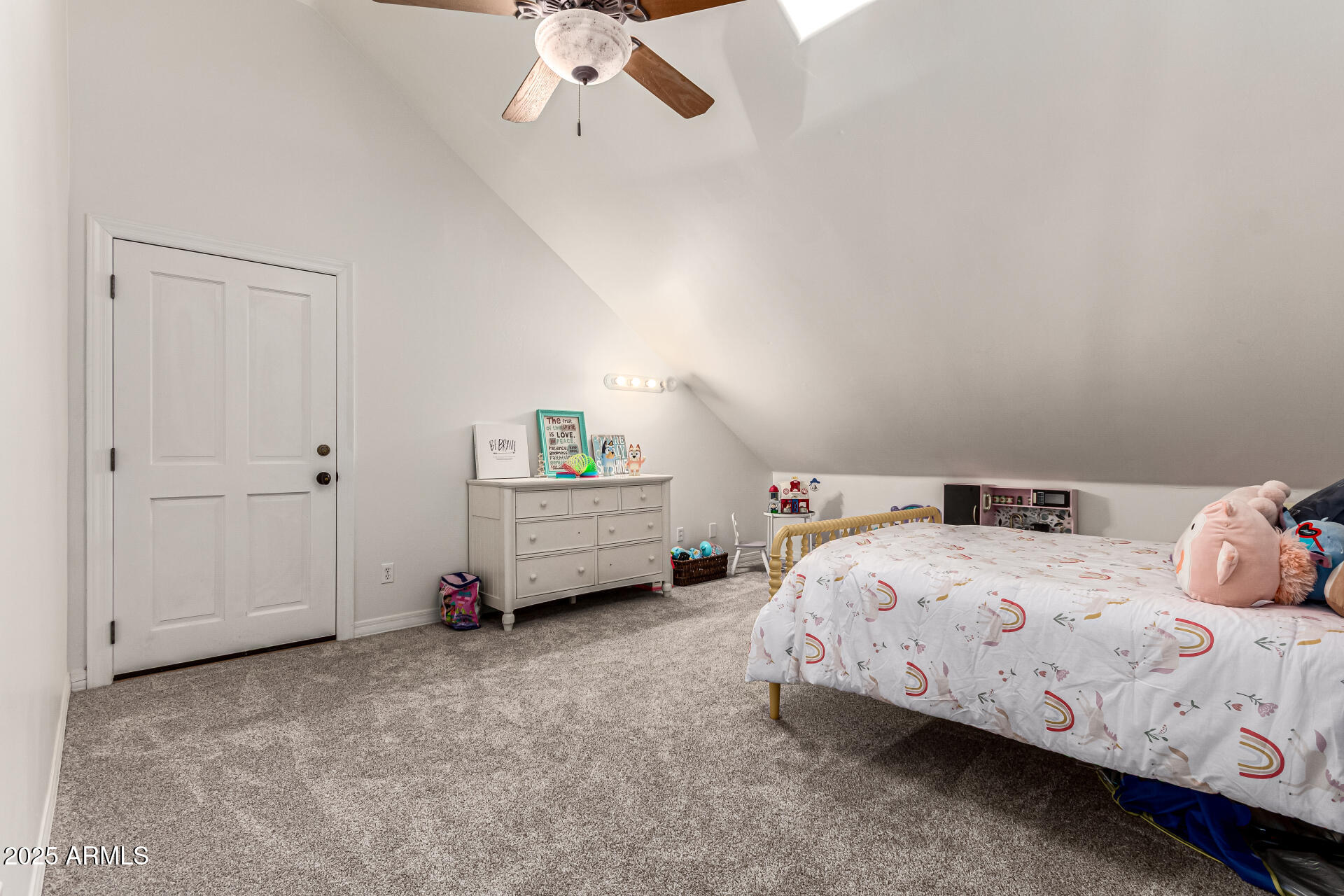 2552 East Ridgewood Lane Gilbert, AZ 85298 - Photo 43 of 80 a bedroom with a bed and a chandelier