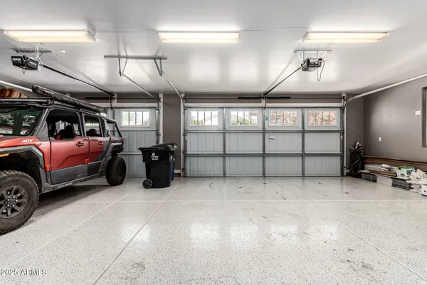 an aerial view of residential houses with outdoor space and ocean view