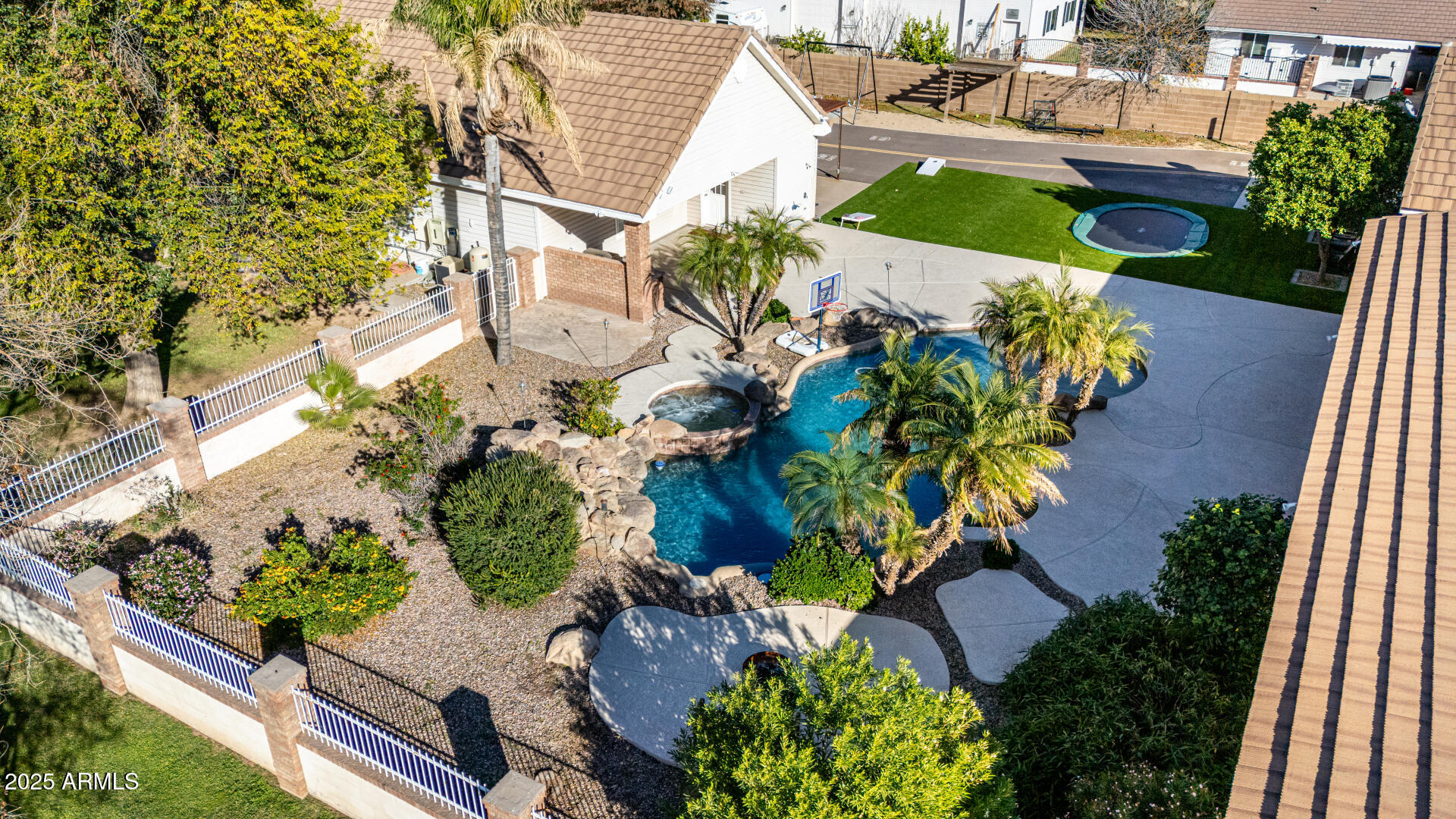 2552 East Ridgewood Lane Gilbert, AZ 85298 - Photo 51 of 80 an aerial view of a house with a yard and garden