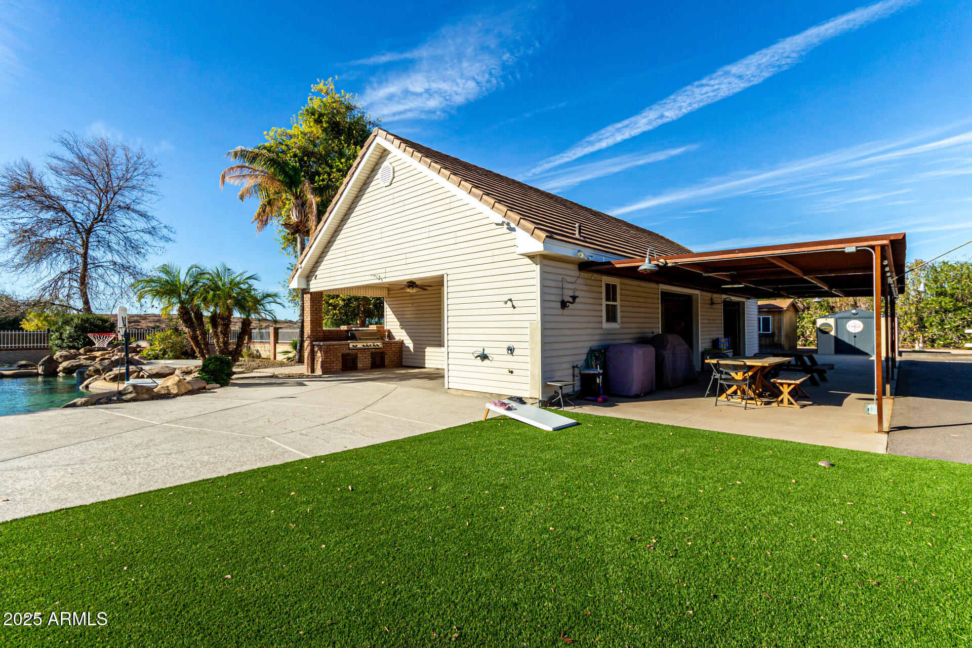 2552 East Ridgewood Lane Gilbert, AZ 85298 - Photo 55 of 80 a view of a house with a yard and sitting area