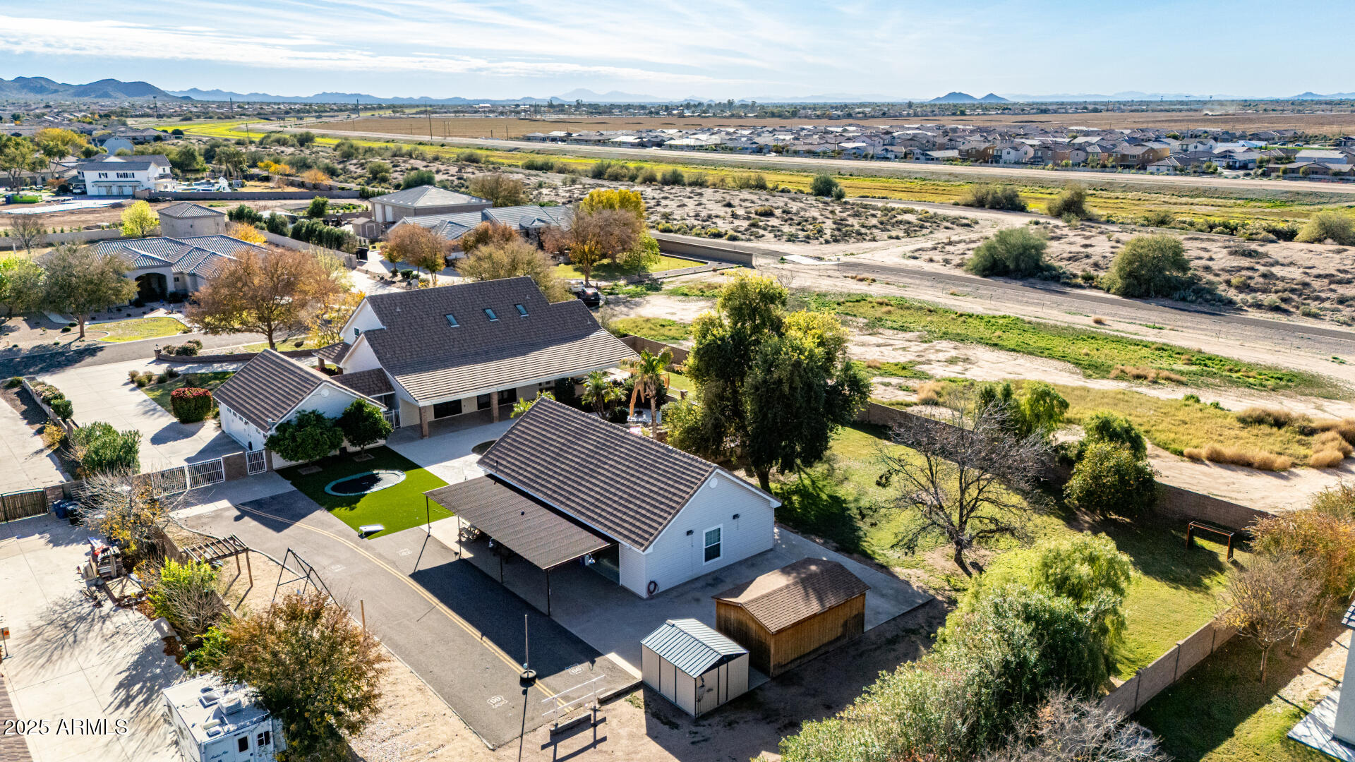 2552 East Ridgewood Lane Gilbert, AZ 85298 - Photo 7 of 80 an aerial view of residential houses with outdoor space and ocean view
