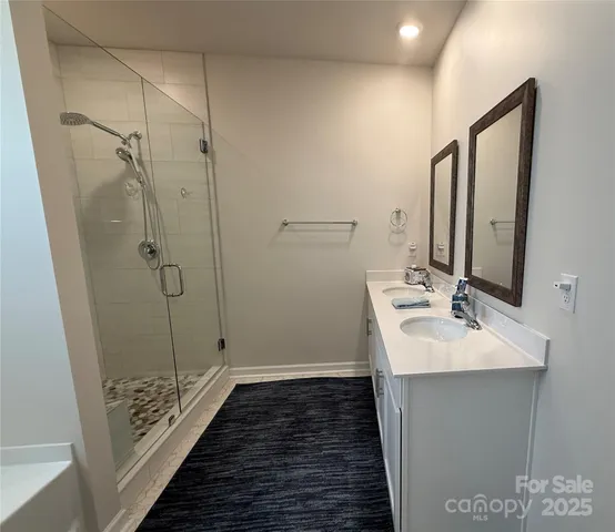 a bathroom with a sink and shower
