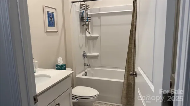 a bathroom with a toilet and a bathtub