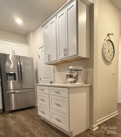 a kitchen with appliances cabinets and a window