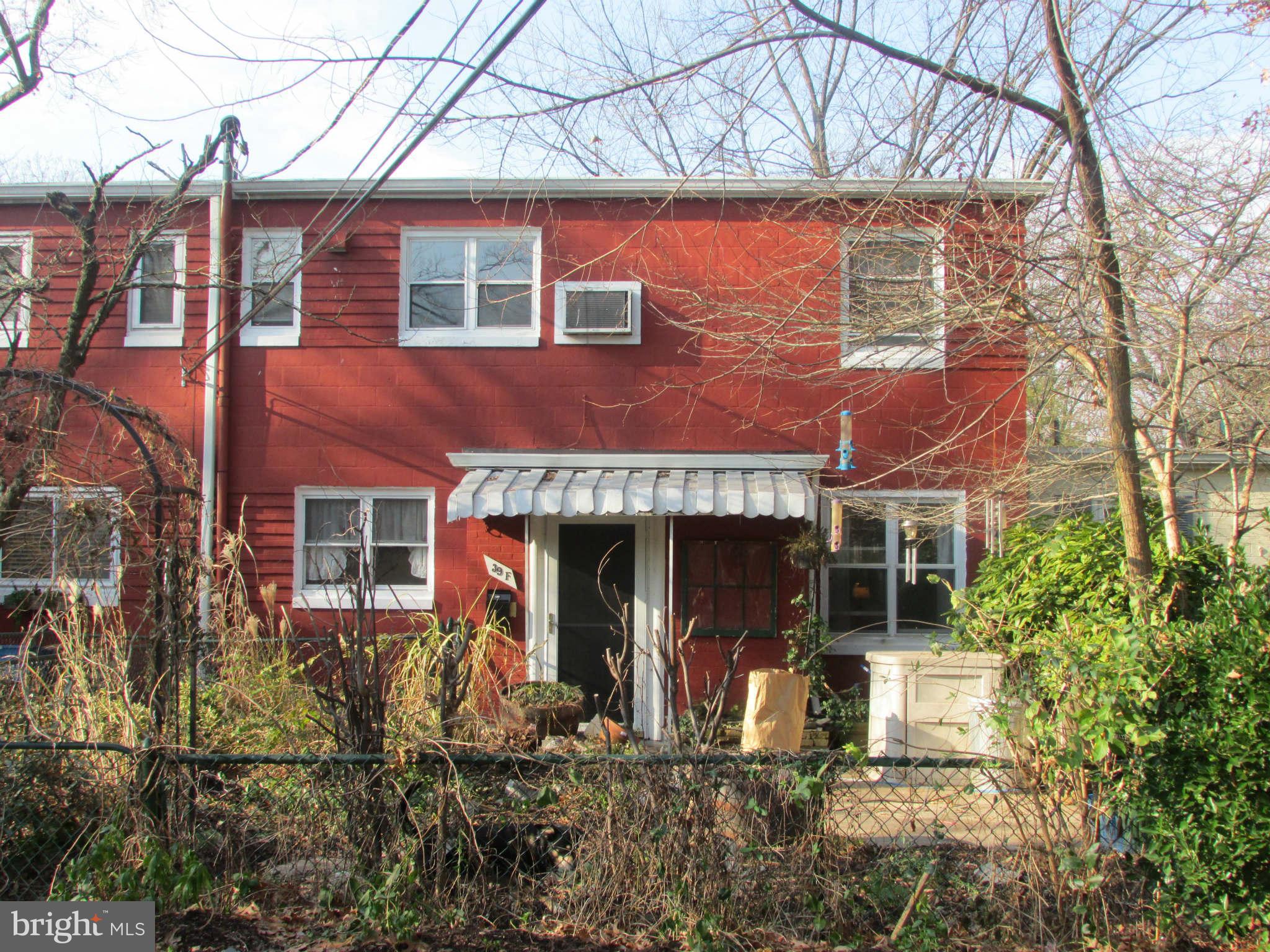 front view of a house with a small yard