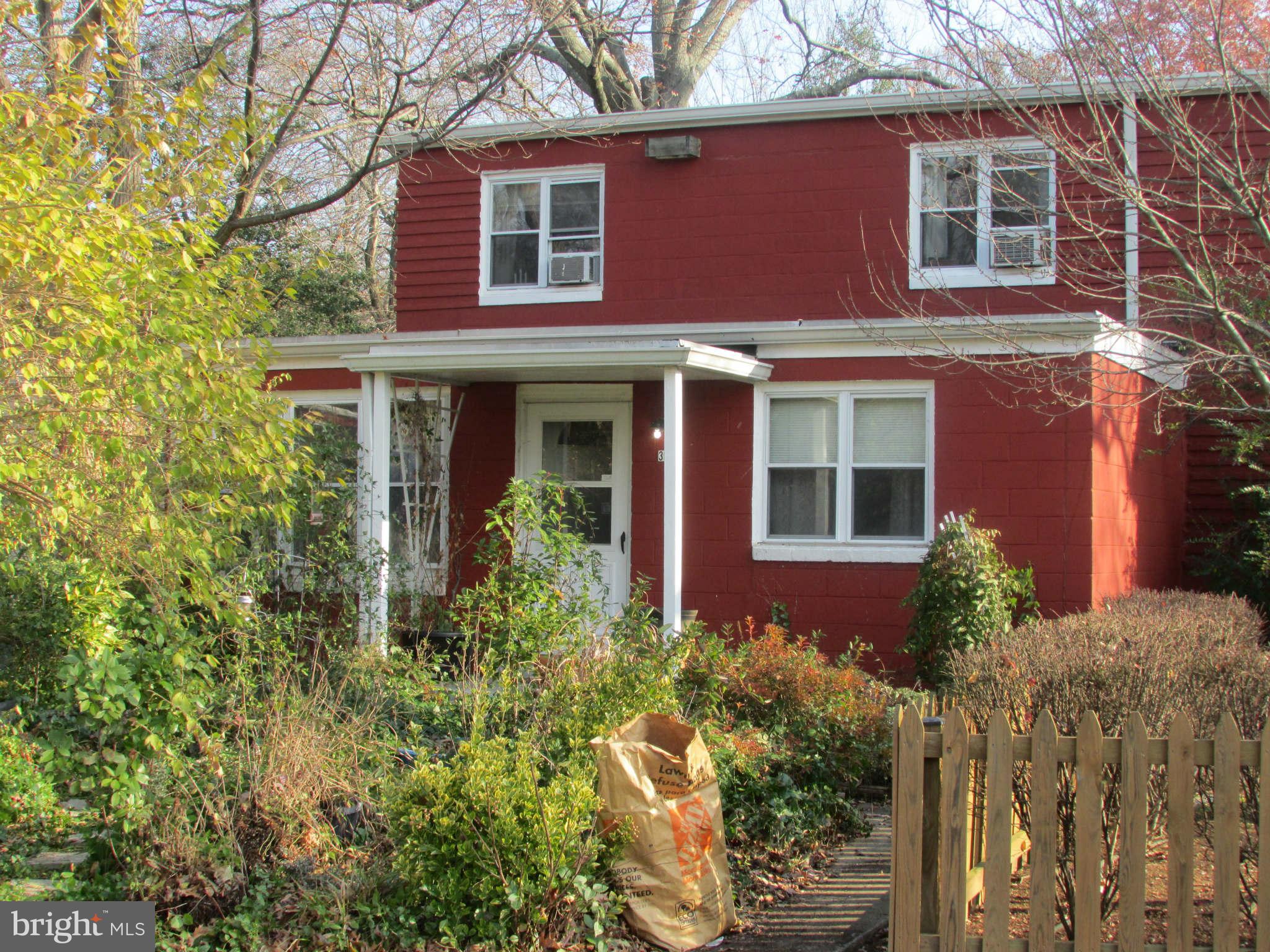 39 Ridge Road, Unit F Greenbelt, MD 20770 - Photo 2 of 14 a front view of a house with a yard