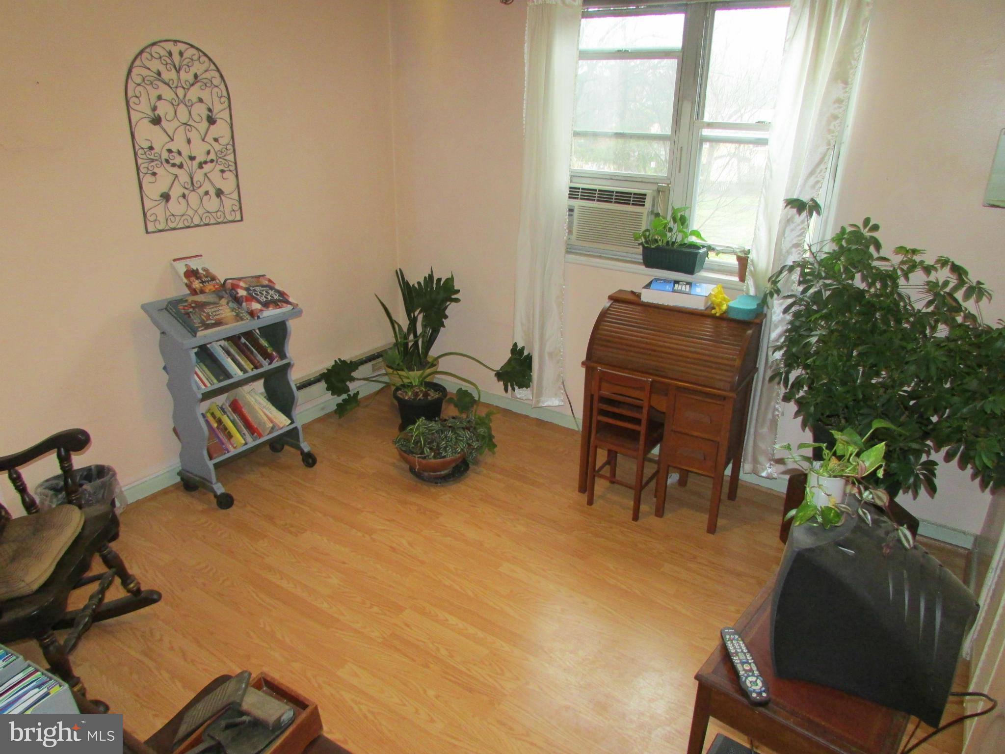 39 Ridge Road, Unit F Greenbelt, MD 20770 - Photo 12 of 14 a room with furniture and a potted plant