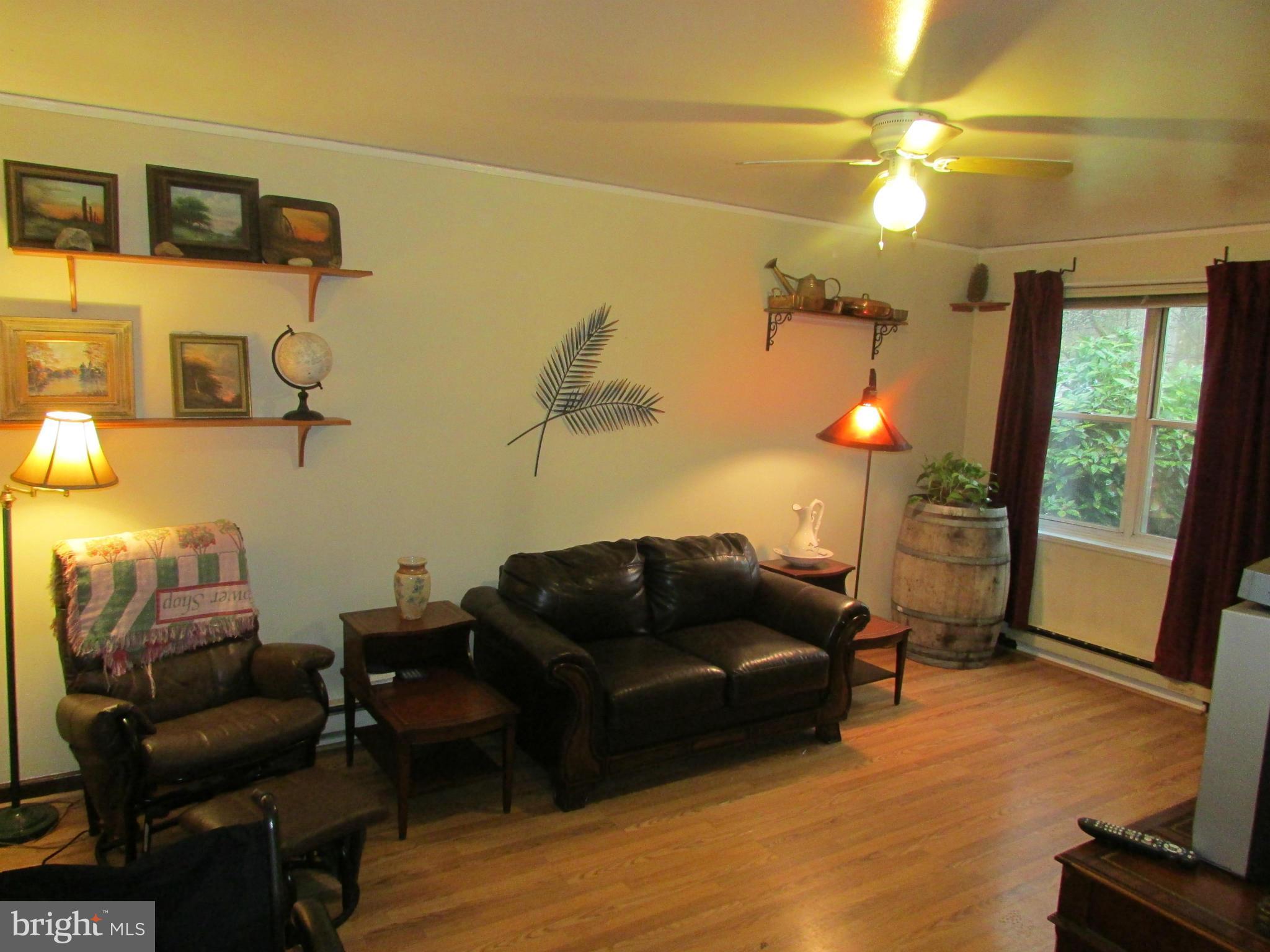 39 Ridge Road, Unit F Greenbelt, MD 20770 - Photo 3 of 14 a living room with furniture and a window