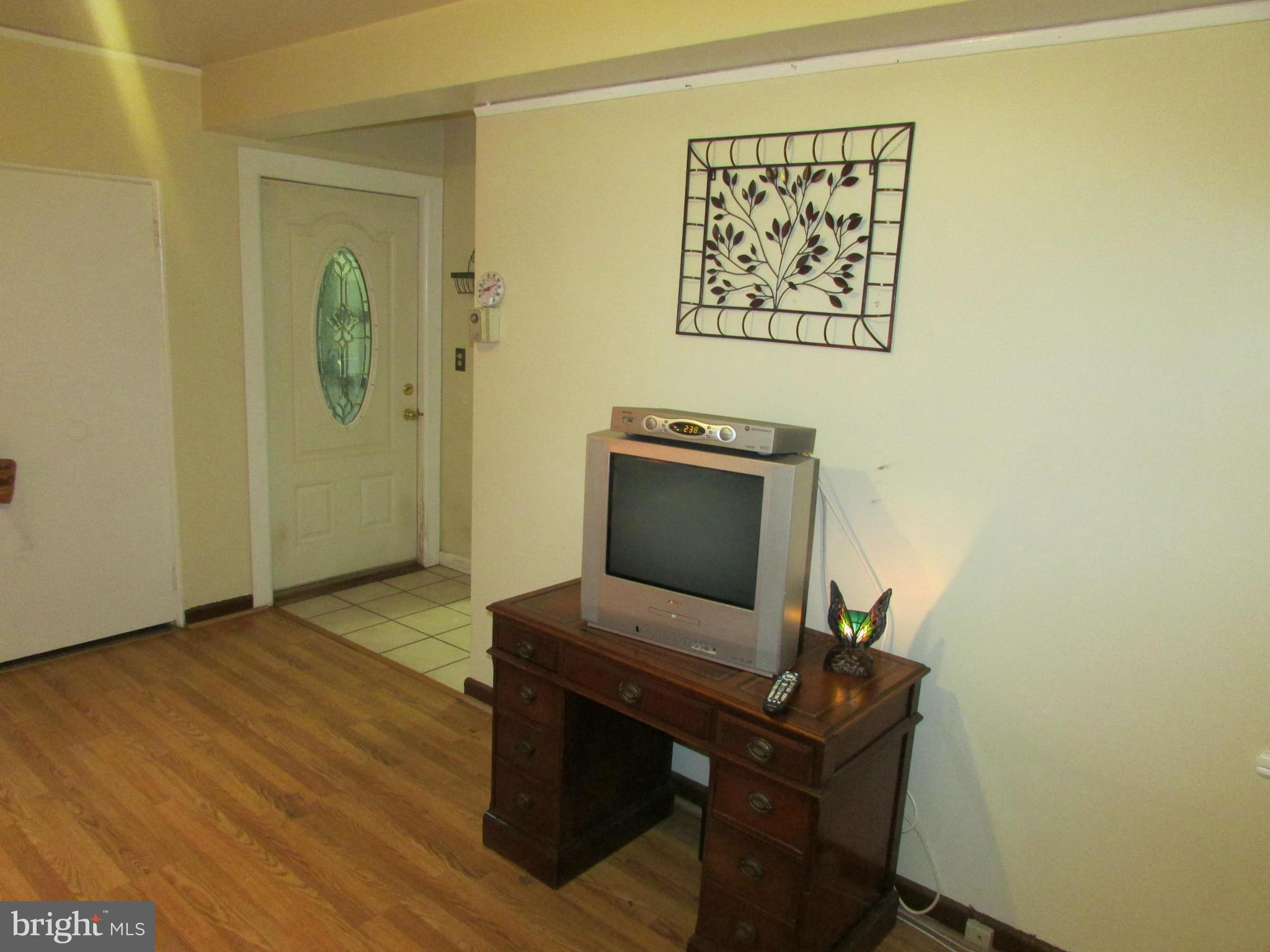 39 Ridge Road, Unit F Greenbelt, MD 20770 - Photo 4 of 14 a view of a workspace with furniture and wooden floor