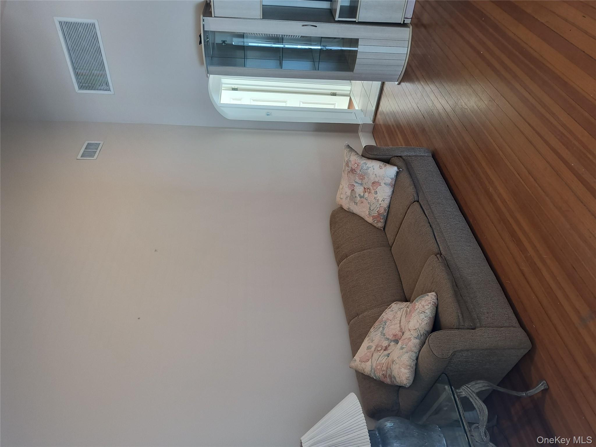 25 July Walk Long Beach, NY 11561 - Photo 11 of 15 Living room with couch and end table.