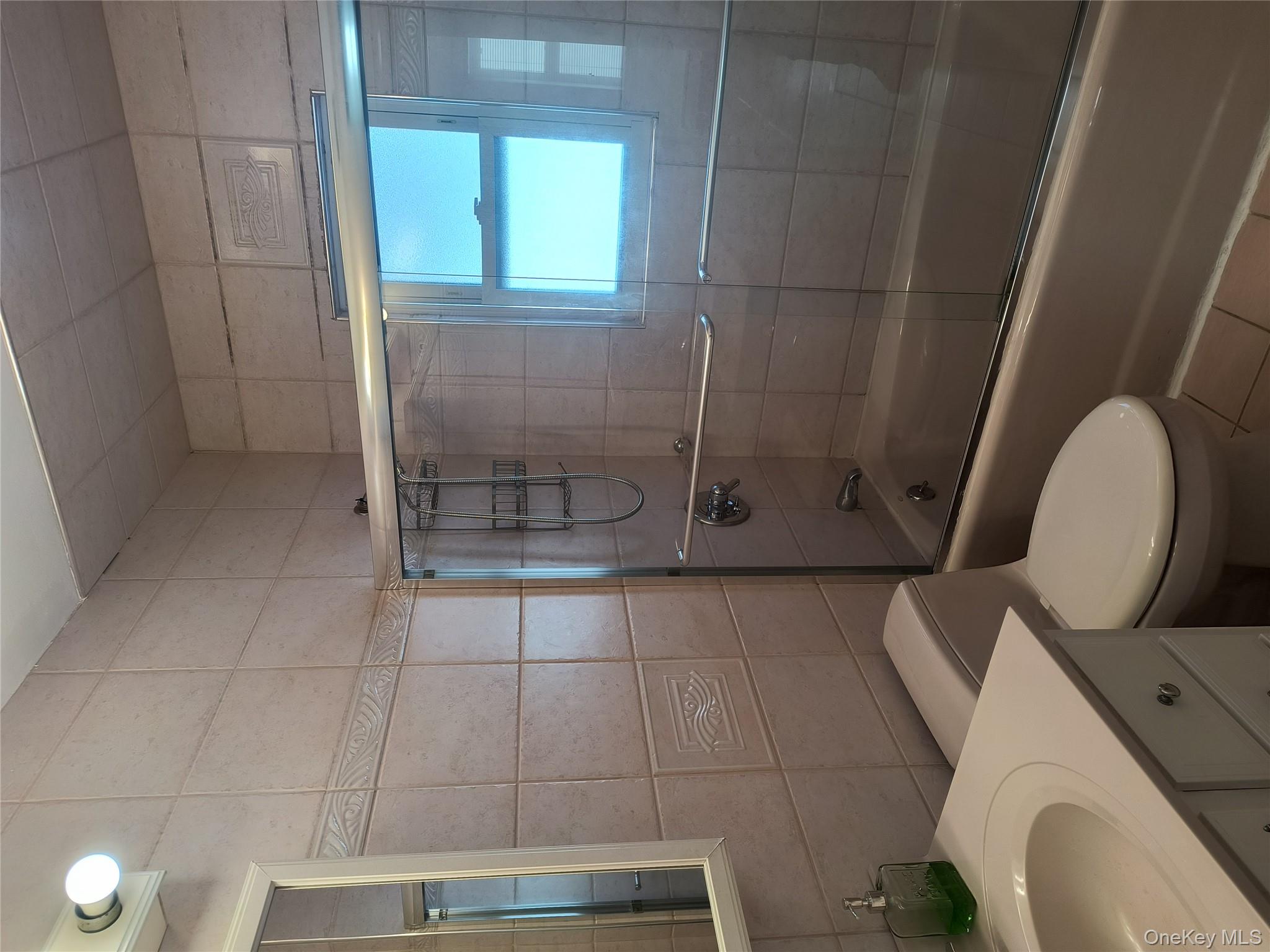 25 July Walk Long Beach, NY 11561 - Photo 7 of 15 full bathroom with tub and shower head