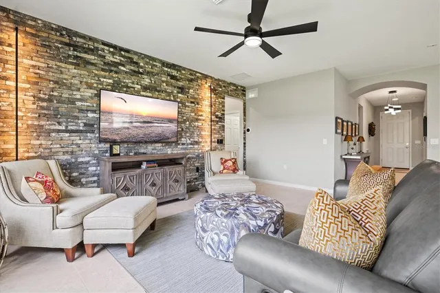 a living room with furniture and kitchen view