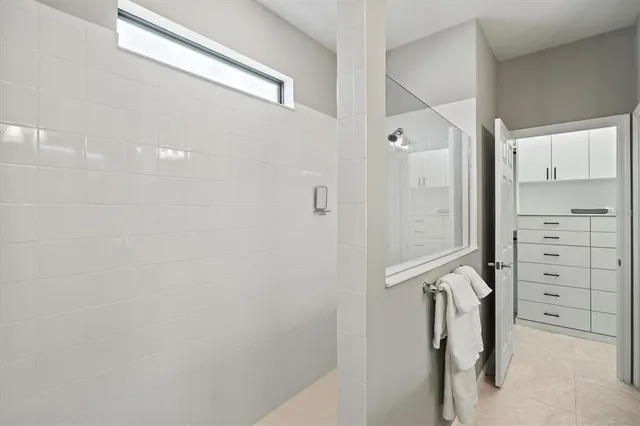 a view of bedroom with a bed and a window