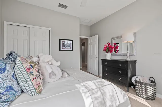 an aerial view of residential houses with outdoor space and ocean view