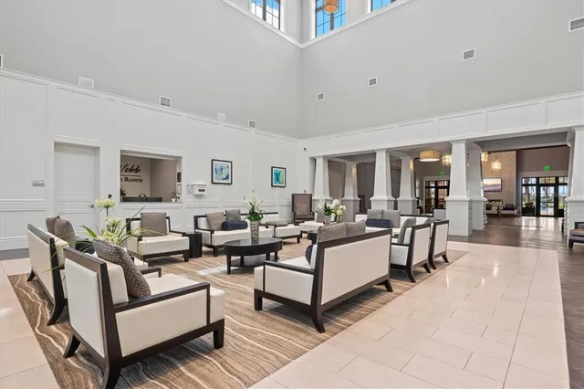 a view of a patio with a table & chairs