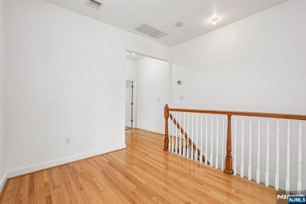 90 A Hackensack Plank Road Weehawken, NJ 07086 - Photo 21 of 40 a view of hallway with wooden floor