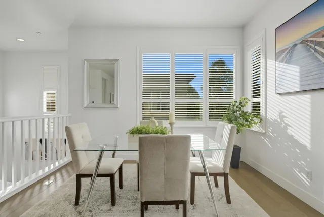 a dining room with furniture and windows
