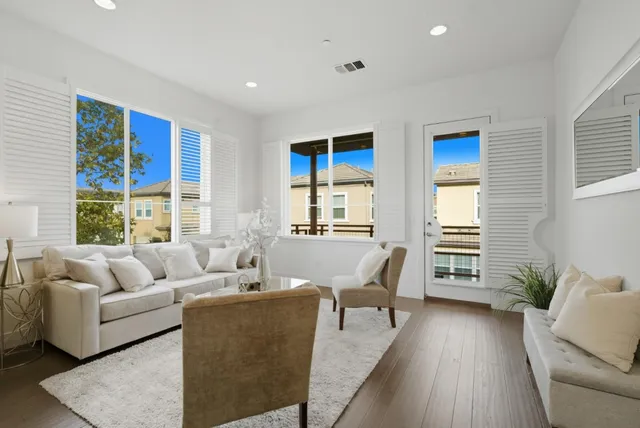 a living room with furniture and windows